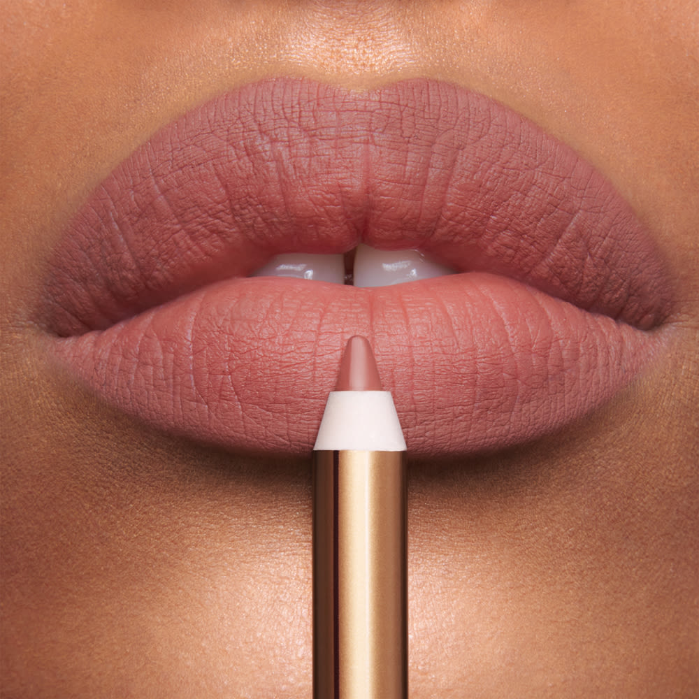 Icon Baby Lip Cheat on medium skin tone model