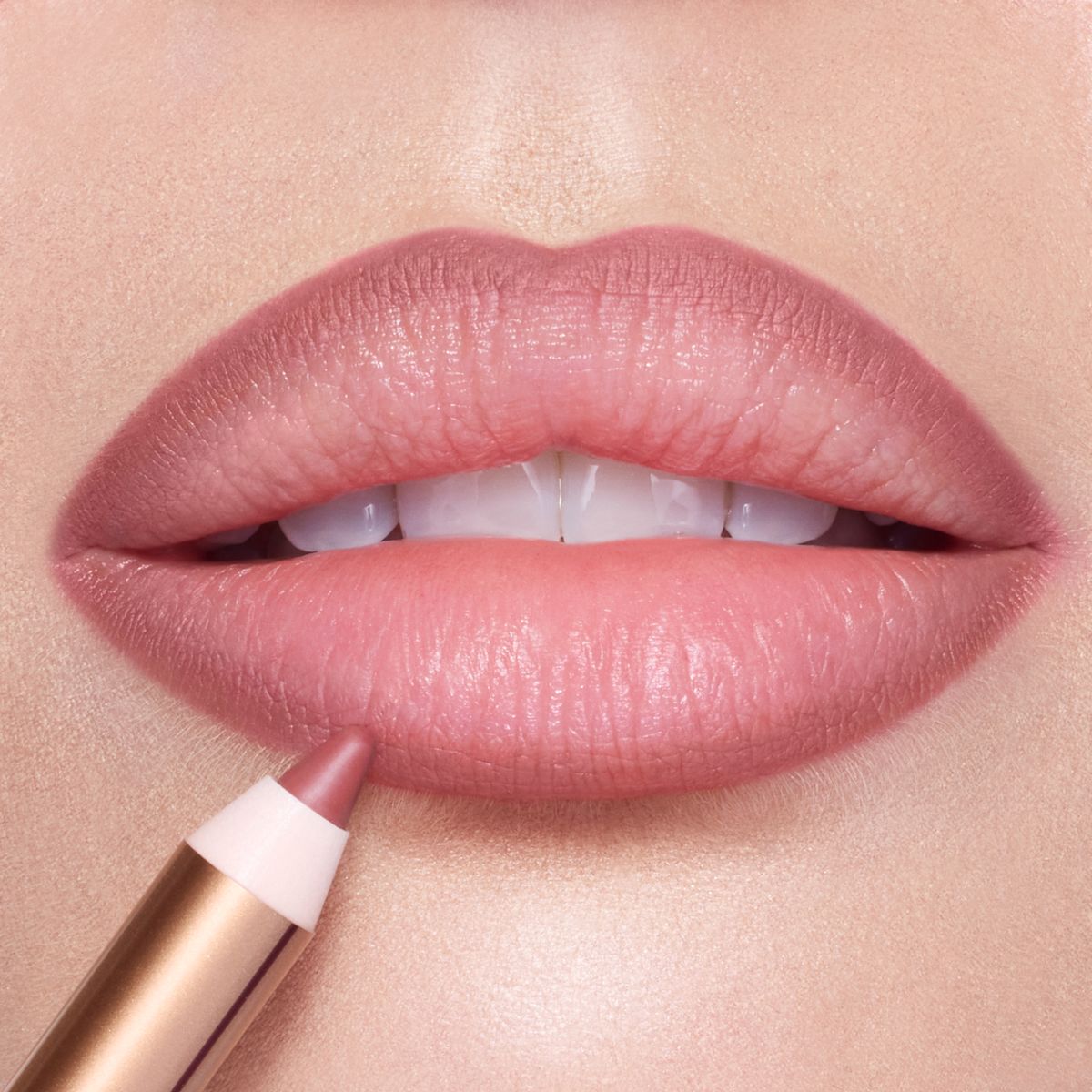 Lip Cheat Pillow Talk Medium Lip Liner on a close up of lips