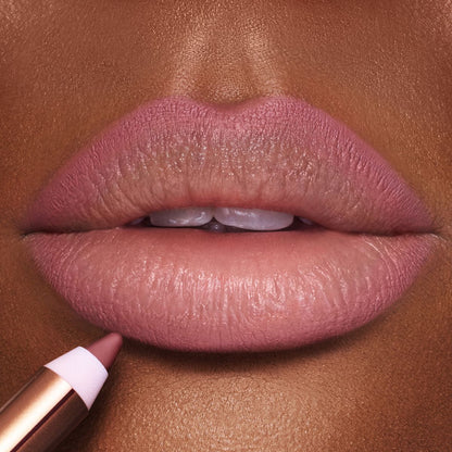 Lip Cheat Pillow Talk Medium Lip Liner on a close up of lips