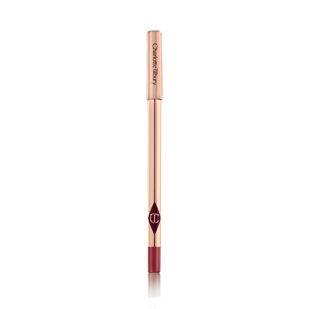 A lip liner pencil in a bold red shade with gold-coloured packaging.
