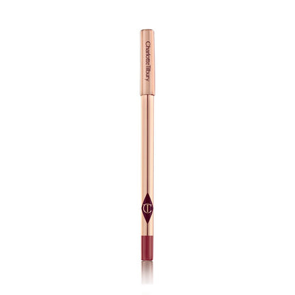 A lip liner pencil in a bold red shade with gold-coloured packaging.
