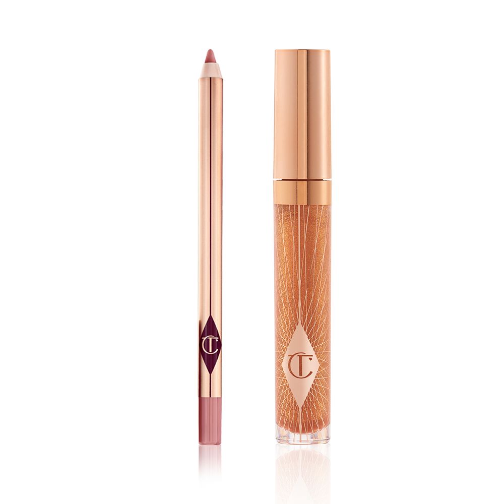 An open lip liner pencil in a nude pink shade and a closed, lip gloss in a sheer gold shade with a gold-coloured lid.