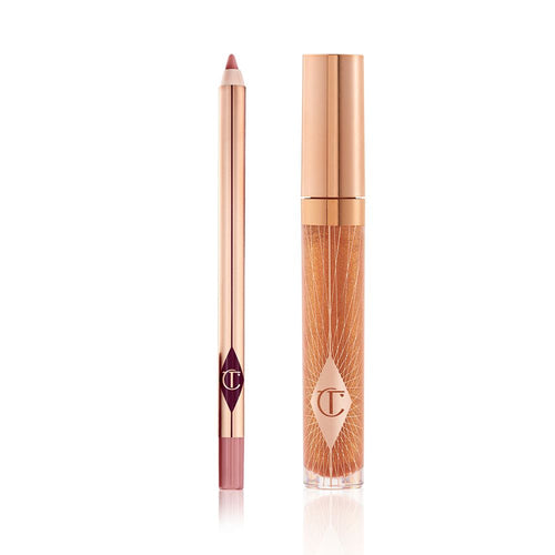 An open lip liner pencil in a nude pink shade and a closed, lip gloss in a sheer gold shade with a gold-coloured lid.