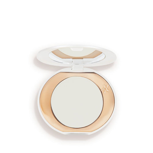 A miniature compact brightening powder in a white shade for fair and medium skin tones.