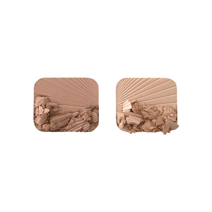 Swatches of a glowy, duo powder contour palette for light to medium skin tones.