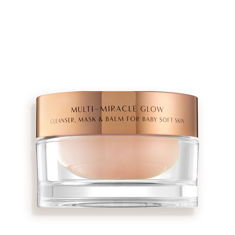 A 3-in-1 face fawn-coloured cleanser, mask, and balm in a glass jar with gold-coloured lid.