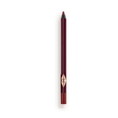 a berry-brown eyeliner pencil with its cap removed.
