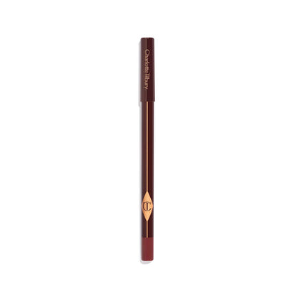 A dark brown eyeliner pencil with its nude-pink coloured box next to it.