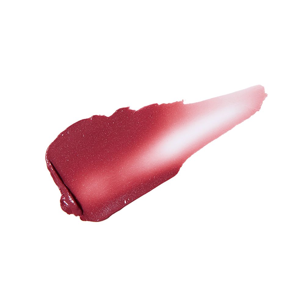 Swatch of a cheek and eye cream in a dark berry-pink shade.