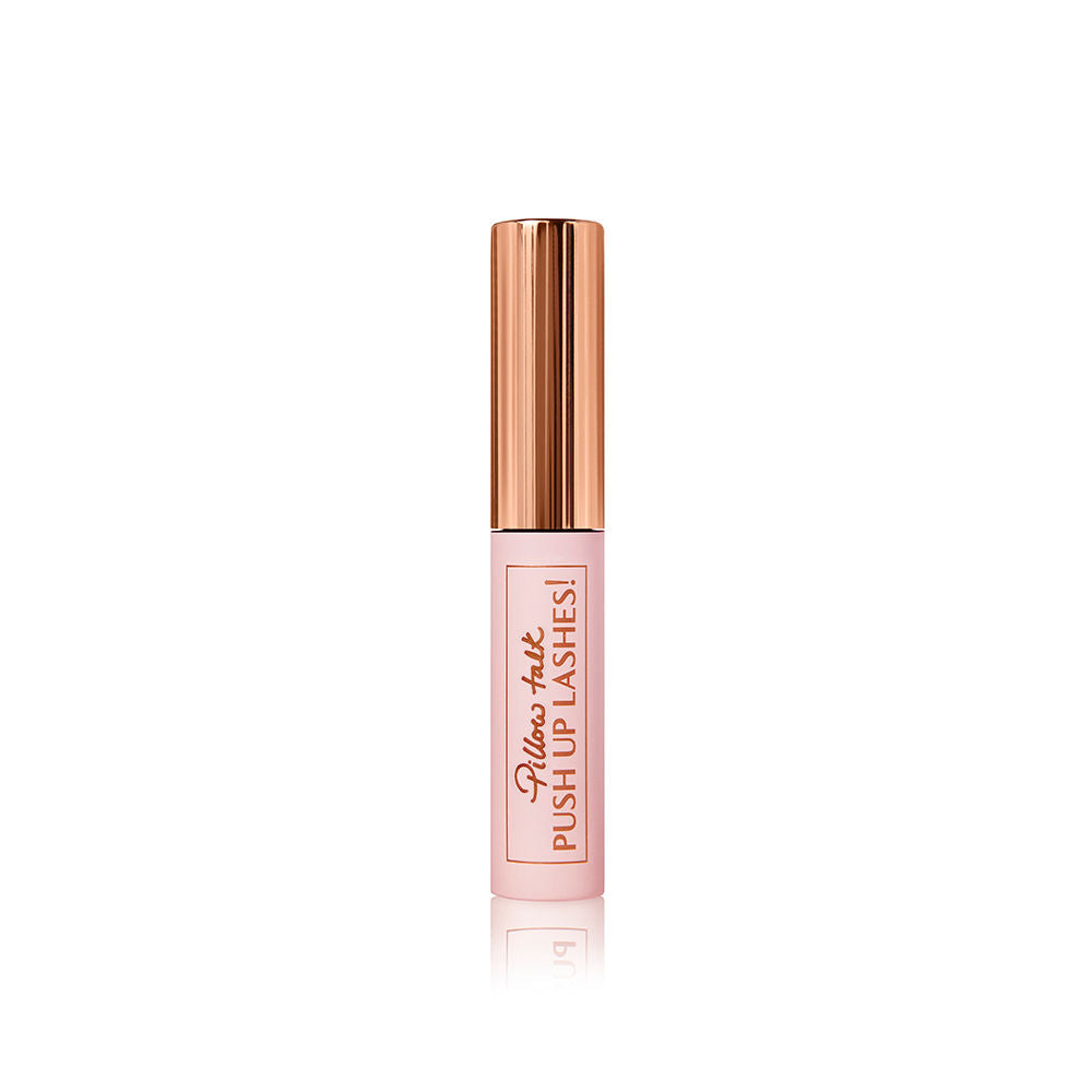 A travel-size mascara in a pink-coloured tube with a gold-coloured lid.