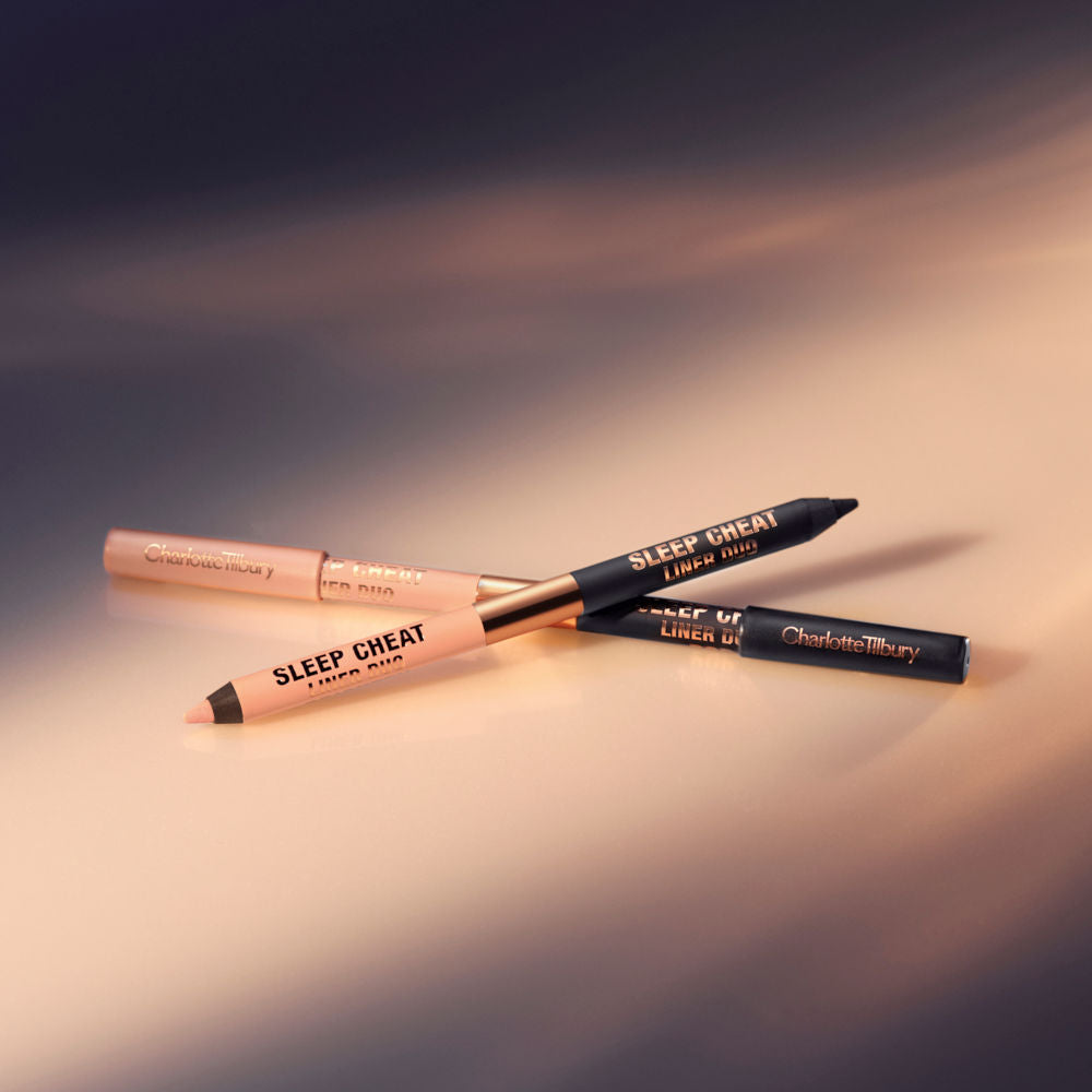 two double-sided eyeliner pencils in jet black and nude beige, with and without lids.
