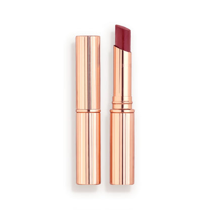 Two lipstick lip blams, with and without lid, in a berry-pink shade with gold-coloured packaging.