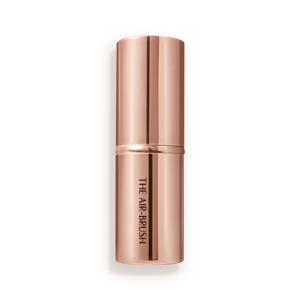 A face blending brush in rose gold packaging.