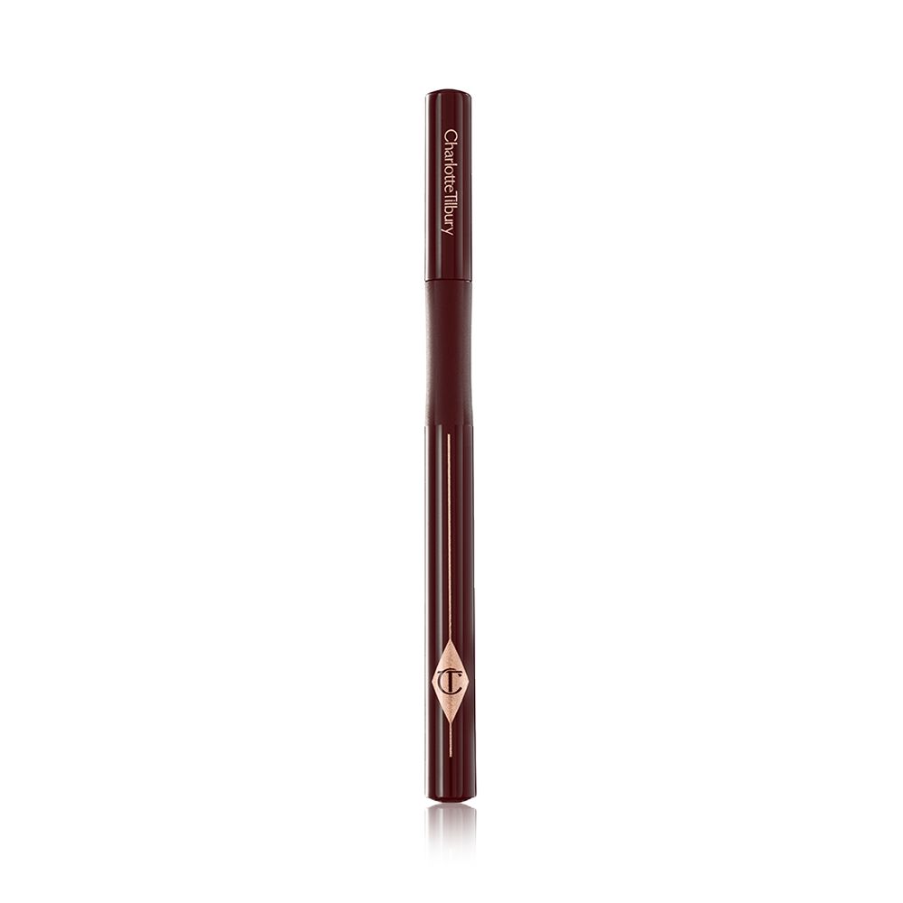 A dark brown eyeliner pen with its lid closed and the CT symbol embossed on it.
