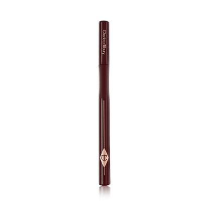 A dark brown eyeliner pen with its lid closed and the CT symbol embossed on it.
