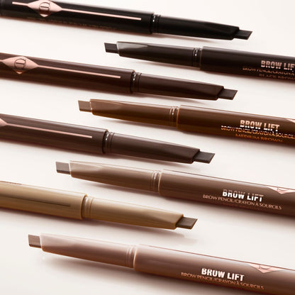 A collection of double-ended eyebrow pencils and eyebrow brushes in shades of black, black-brown, light brown, medium brown, soft brown, dark brown, taupe, and light blonde.
